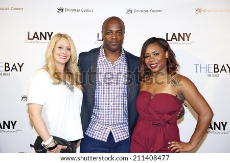 LOS ANGELES/CALIFORNIA - AUGUST 4, 2014: C.Hawley, D.Harris & guest walk the red carpet at \