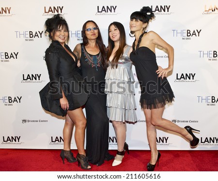 LOS ANGELES/CALIFORNIA - AUGUST 4, 2014: Actress Bai Ling & guest walk the red carpet at \
