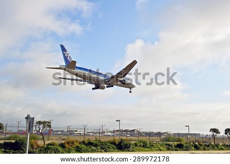 LOS ANGELES/CALIFORNIA - JUNE 13, 2015: ANA (All Nippon Airways) commercial jet on approach to runway at Los Angeles International Airport in Los Angeles, California, USA
