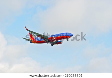 LOS ANGELES/CALIFORNIA - JUNE 13, 2015: Southwest Airlines commercial jet on approach to runway at Los Angeles International Airport in Los Angeles, California, USA