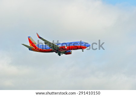 LOS ANGELES/CALIFORNIA - JUNE 13, 2015: Southwest Airlines commercial jet on approach to runway at Los Angeles International Airport in Los Angeles, California, USA