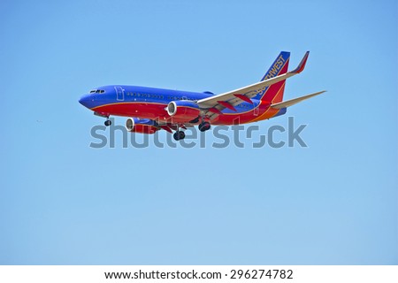 LOS ANGELES/CALIFORNIA - JULY 12, 2015: Southwest Airlines Boeing 737-700 on approach to runway at Los Angeles International Airport in Los Angeles, California, USA
