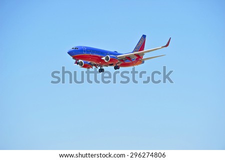 LOS ANGELES/CALIFORNIA - JULY 12, 2015: Southwest Airlines Boeing 737-700 on approach to runway at Los Angeles International Airport in Los Angeles, California, USA