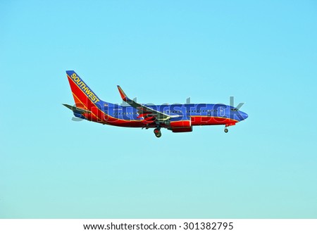 LOS ANGELES/CALIFORNIA - JULY 12, 2015: Southwest Airlines Boeing 737 on approach to runway at Los Angeles International Airport in Los Angeles, California, USA
