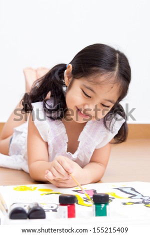 Little Asian artist kid drawing and painting