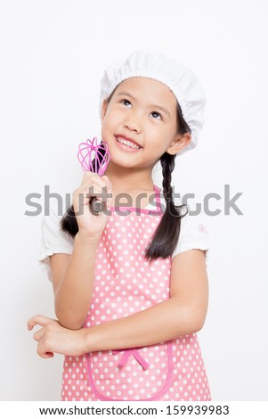 Little Asian cute chef wearing pink apron thinking action