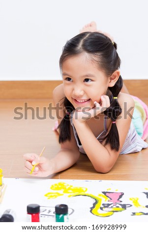 Happy Asian artist child drawing and painting