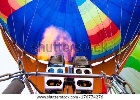 Flame of fire hot air balloon take of to the sky