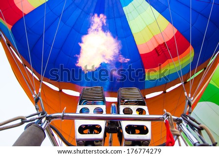 Flame of fire hot air balloon take of to the sky