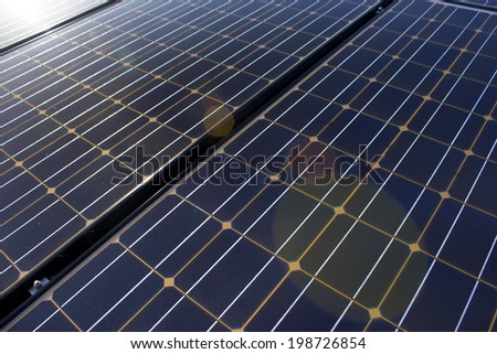 Close up of  solar panels with light flare