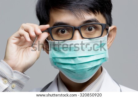 Portrait of Asian businessman wearing protective mask on his face on isolated