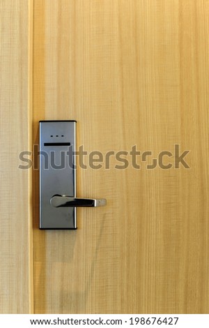 Hotel electronic lock on wooden door