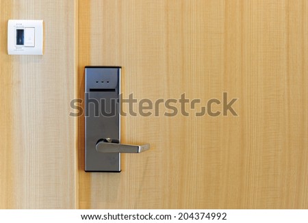 Hotel electronic lock on wooden door