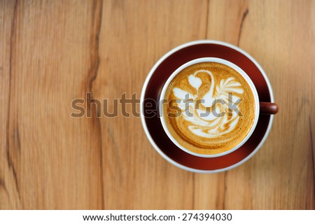 Swan drawing on latte art coffee cup