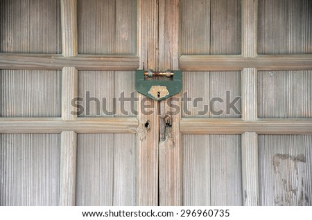 Traditional Japanese wooden door with old lock