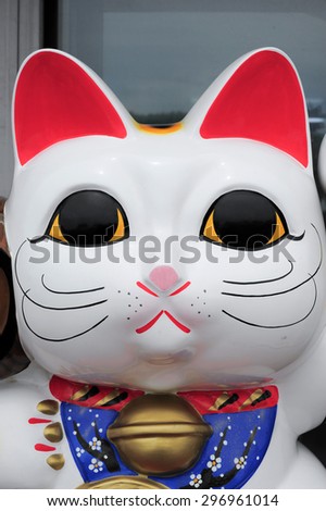 Maneki Neko cat. Common Japanese sculpture bring good luck to the owner.