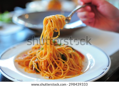 Spaghetti with tomato sauce close up