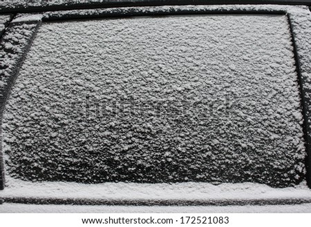 Frozen car window, texture freezing ice glass background