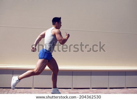 Sportsman running in the city, lifestyle, workout - concept