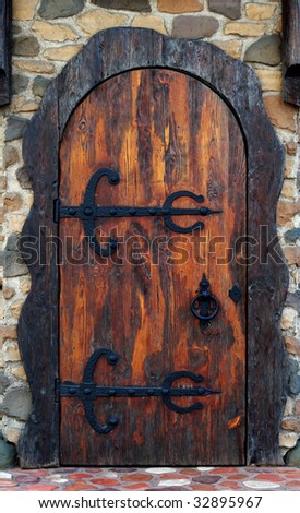 Old wooden door. Old-fashioned pub doorway
