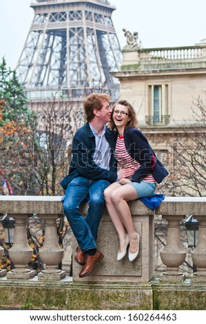 Happy young couple in Paris on a sunny autumn day