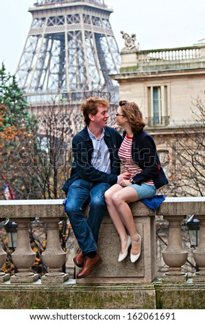 Happy young couple in Paris on a sunny autumn day