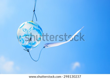 Japanese wind chime against blue sky