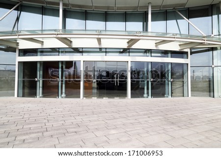 Facade Of Modern Business Center With Glass Doors