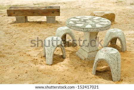 Old stone chair suit under tree shadow