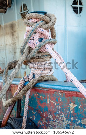 Ropes and pole on deck of big ship