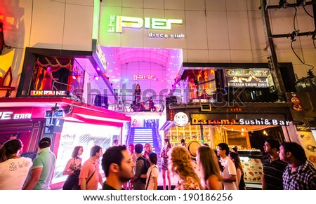 PATTAYA - MAY 1 : Crowd walking through the Walking Street on MAY 1, 2014 in Pattaya, Thailand. It is a tourist attraction primarily for night life and entertainment.