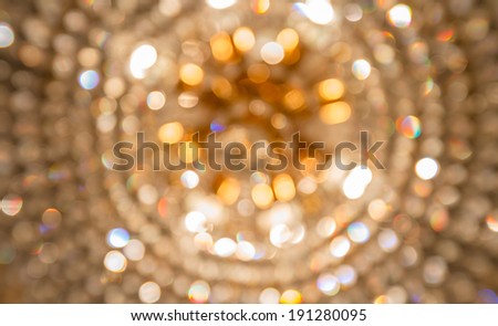 Golden bokeh from crystal chandelier
