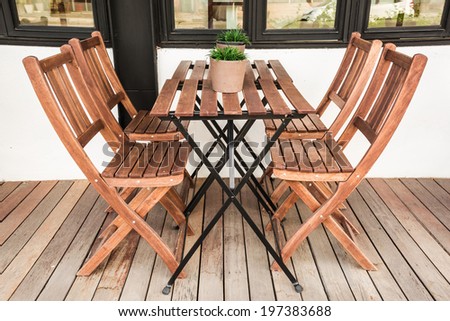 Wood chairs and table on wood terrace