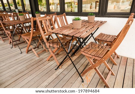 Wood table and chairs on wood terrace