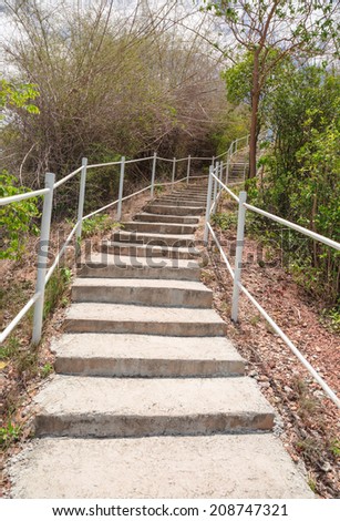 Cement stair way up to a sea shore hill