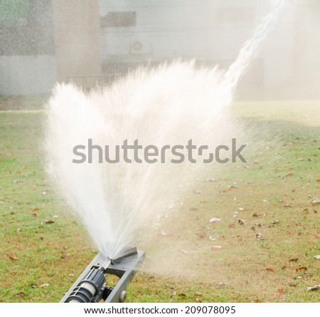 Spray water with high pressure from big sprinkler