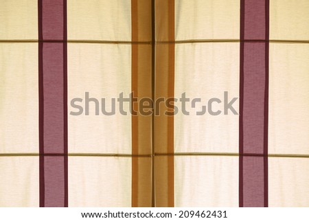 Fabric curtain of window against sunshine
