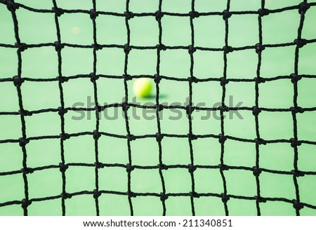 Black net and tennis ball focus on net