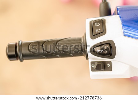 Handle and switches of white motorcycle
