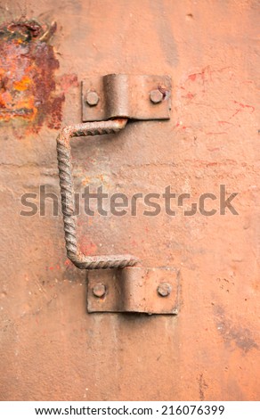 Iron handle of rusty iron door