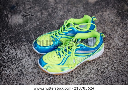 Colorful Running shoes on dark cement floor