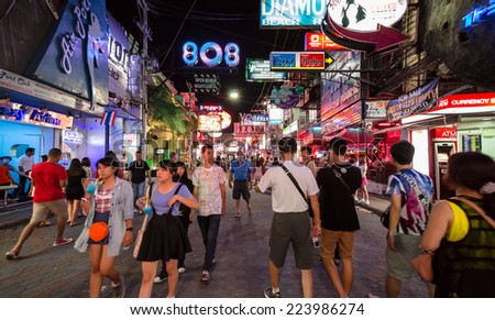 PATTAYA - OCTOBER 10: Crowd walking through the Walking Street on October 10, 2014 in Pattaya,Thailand. It is a tourist attraction primarily for night life and entertainment.