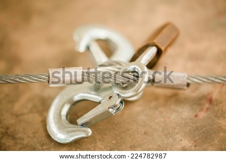 Aluminum hook and new sling locked by golden key