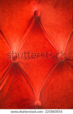 Orange velvet with buttons wall in texture