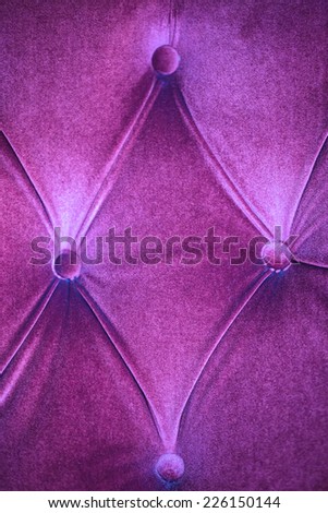 Purple velvet with buttons wall in texture