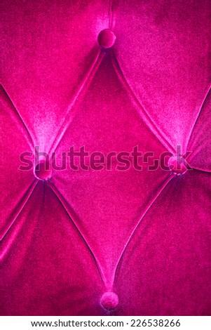 Shocking pink velvet with buttons wall in texture