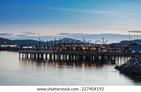 Sea scape with wooden terrace in twilight time