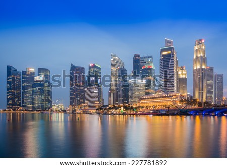 SINGAPORE-NOVEMBER 2: The Singapore skyline in twilight time on November 2,2014. Singapore is the 14th largest exporter and the 15th largest importer in the world