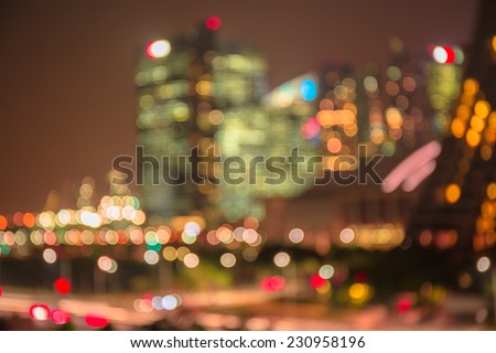 Defocused lights and building of big city in night time