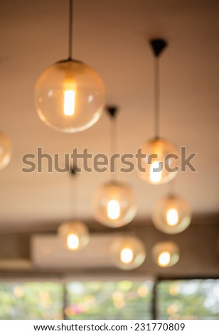 Sphere lamp hanging on white ceiling